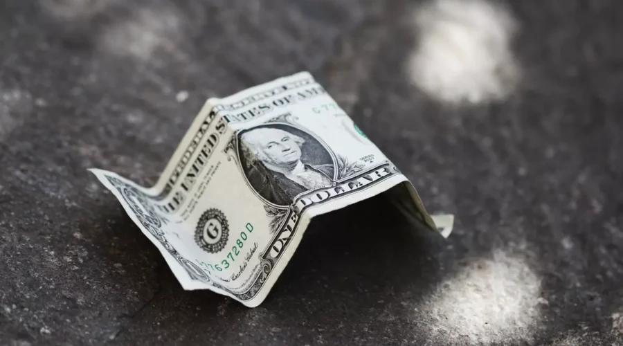 dollar bill on the ground
